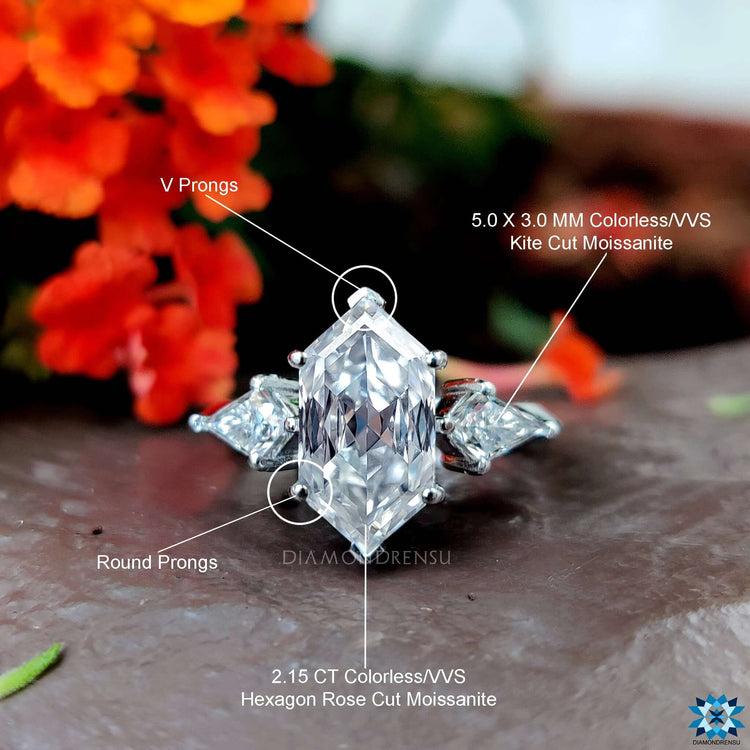 Handmade jewellery piece with three stone moissanite design in a white gold band.
