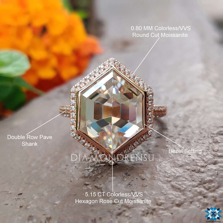 Rose gold ring with round cut halo and pave band.

