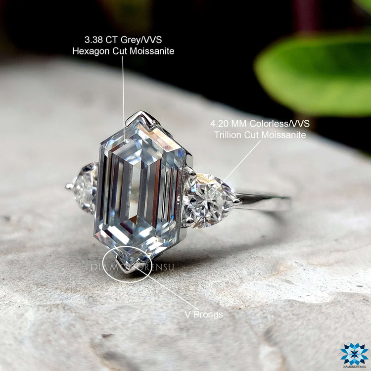 Handmade moissanite engagement ring with hexagon cut and trillion sides.
