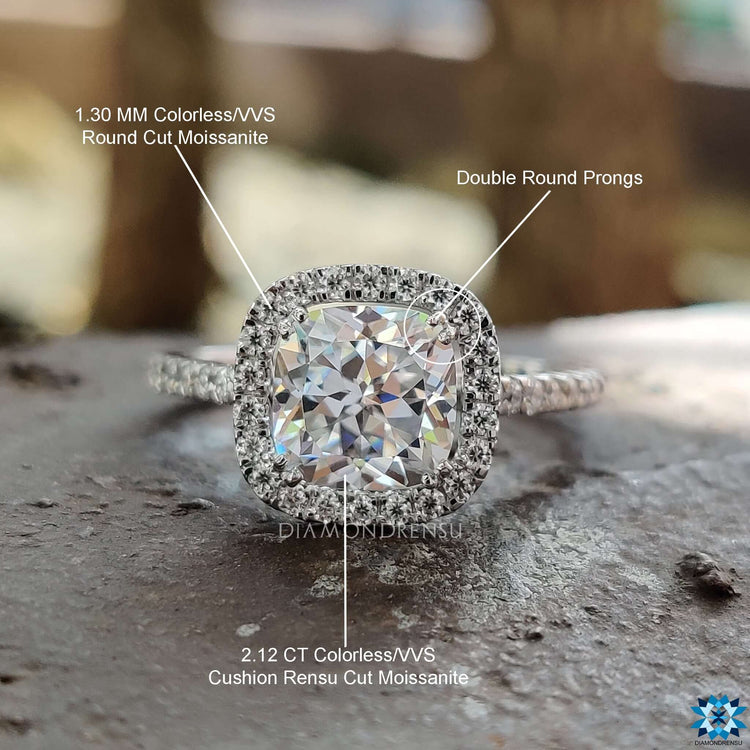 Custom engagement ring with cushion Rensu moissanite and round pave accents.
