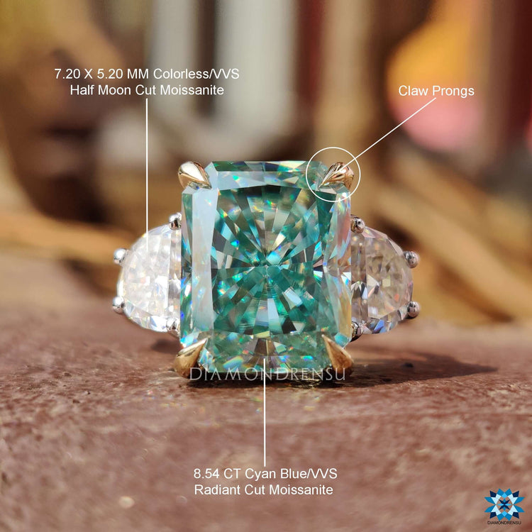 4 prong setting moissanite ring in mixed gold tones.
