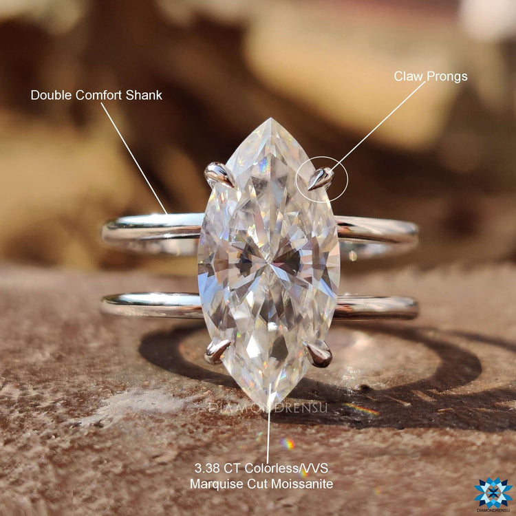 Lab-grown marquise moissanite solitaire ring with dual band.
