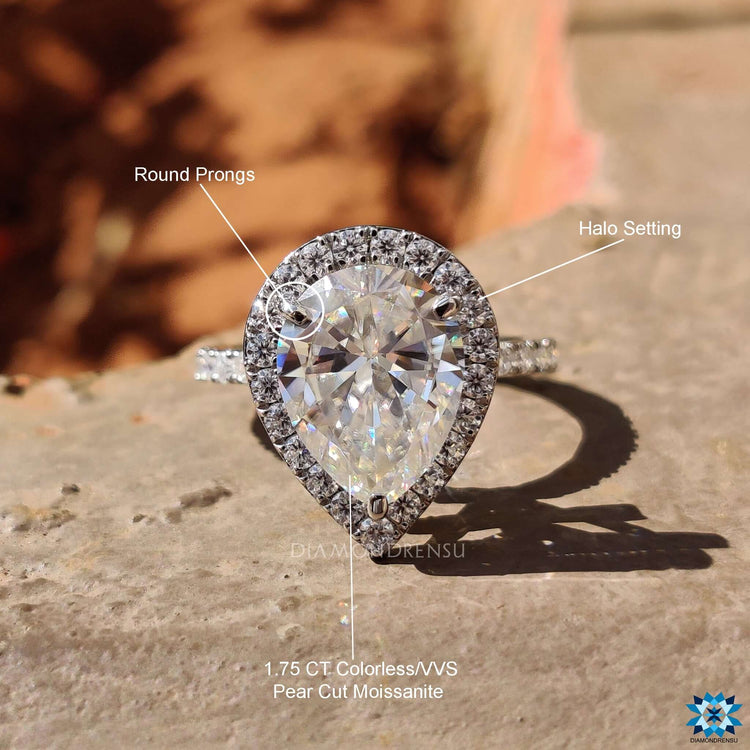 Teardrop moissanite engagement ring in pave setting.
