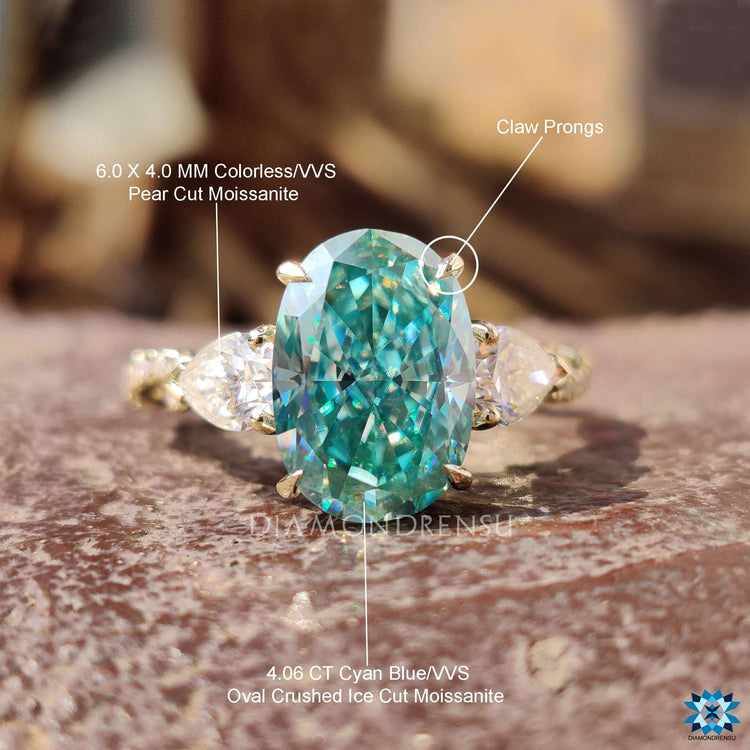 Elegant oval center moissanite ring in yellow gold from Diamondrensu UK.
