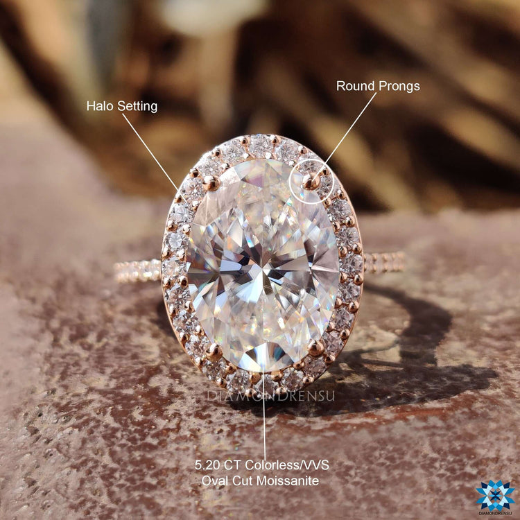 Oval cut moissanite ring with cathedral setting.
