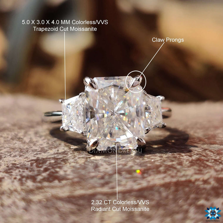 Three stone moissanite ring in white gold setting.
