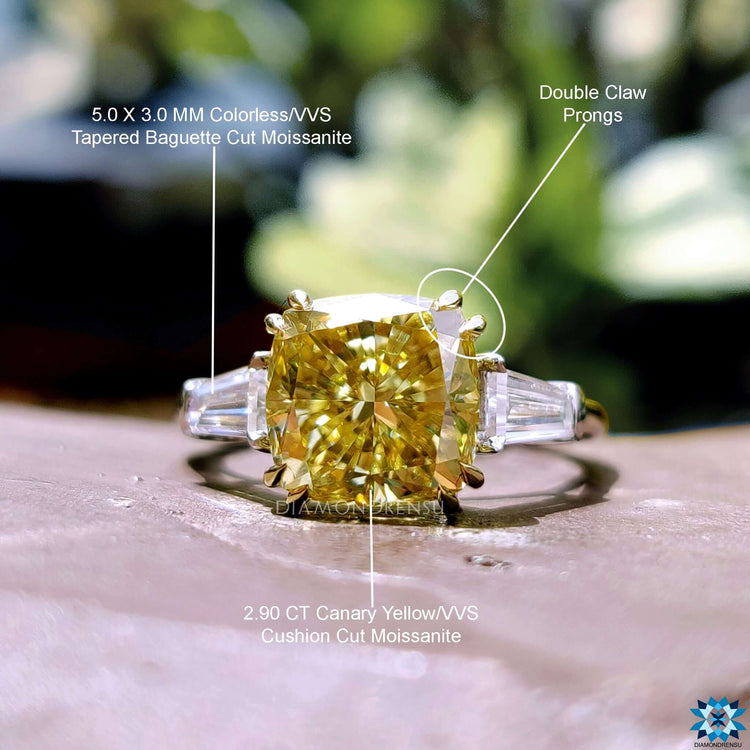 Cathedral setting engagement ring with three stones.
