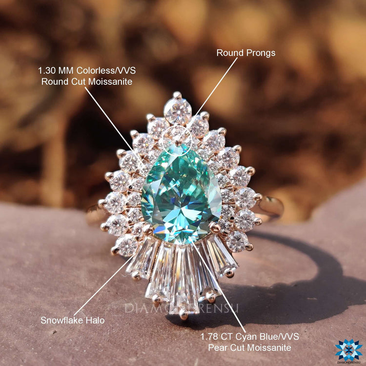 Buy moissanite ring with pear cut center and halo setting.
