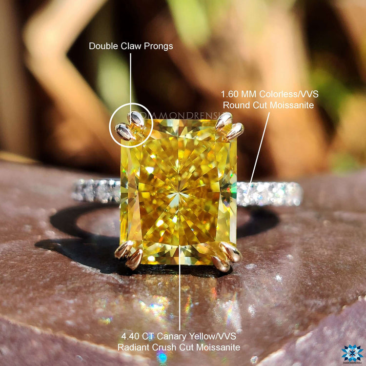 Moissanite engagement ring in mixed metal gold.
