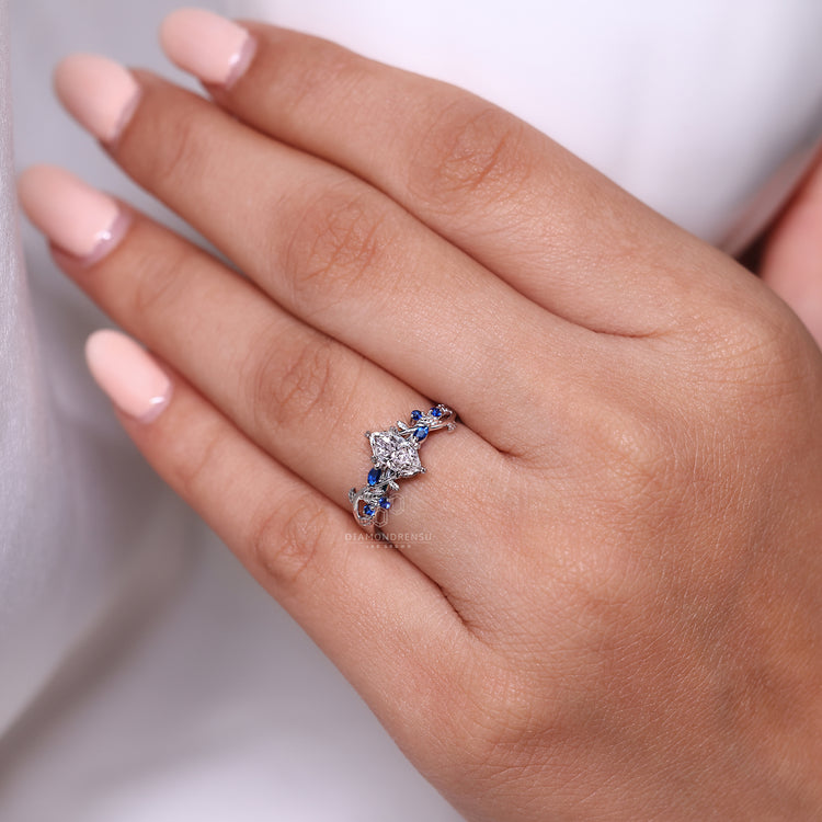 Nature inspired marquise ring with leaf details and tanzanite.
