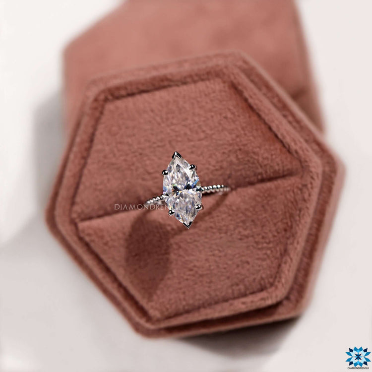 Hidden halo setting with round cut stones.
