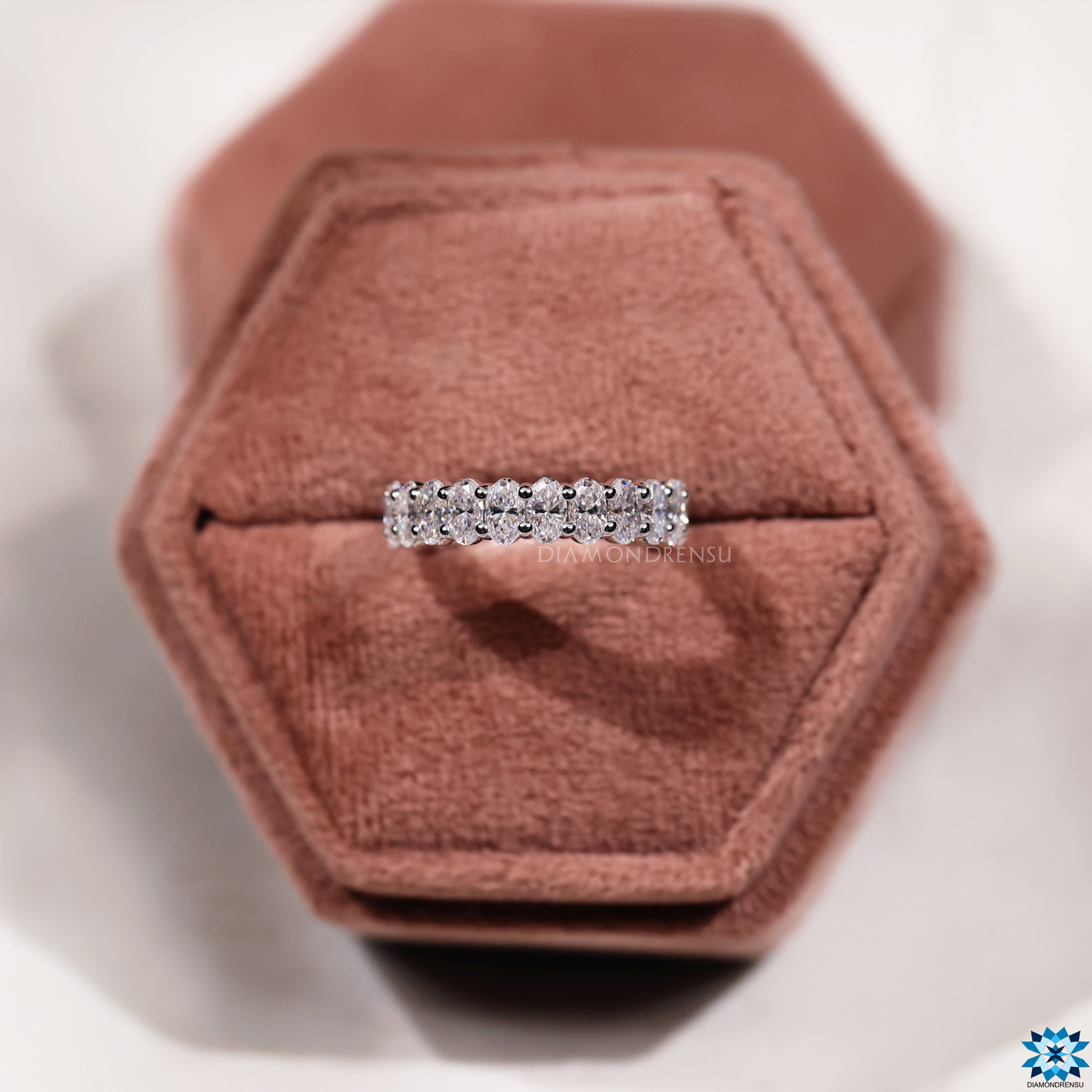 Elegant diamond oval eternity band, ideal for stacking with engagement rings.