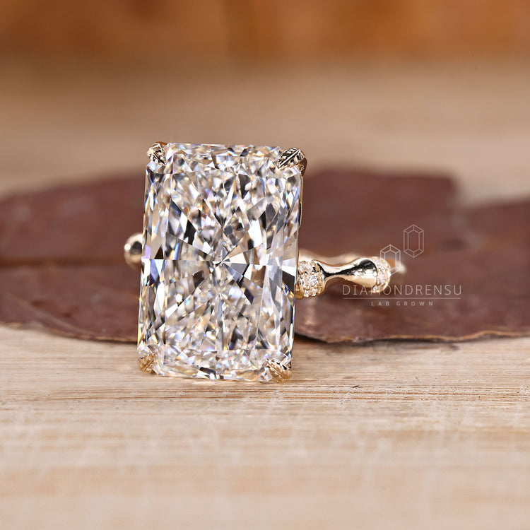 Nature inspired diamond ring with four leaf prong design.