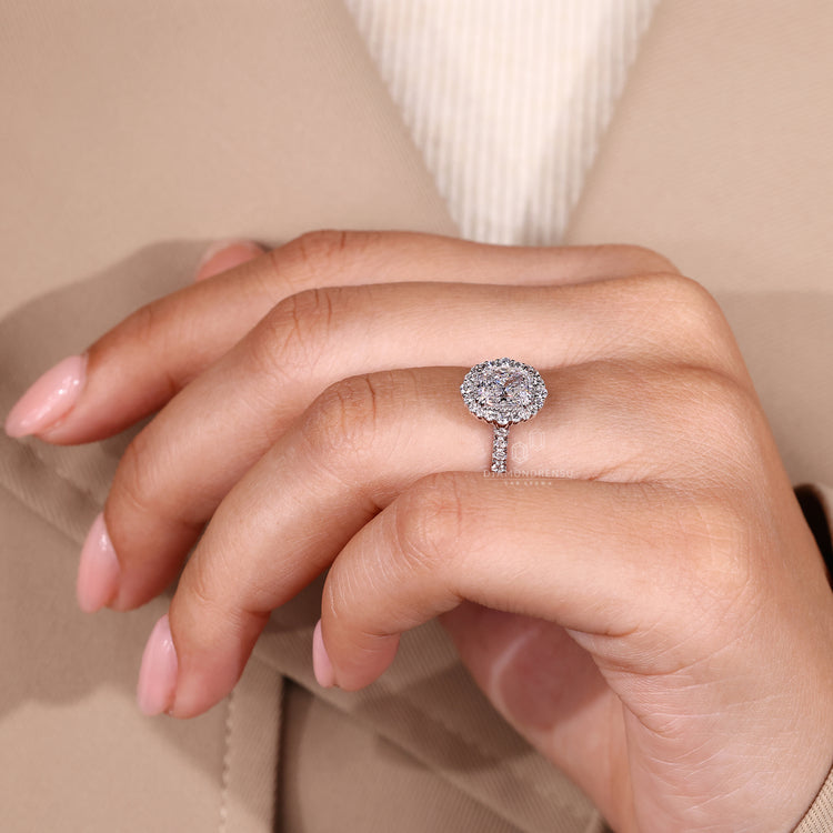 Lab grown cushion diamond ring with double claw prongs.