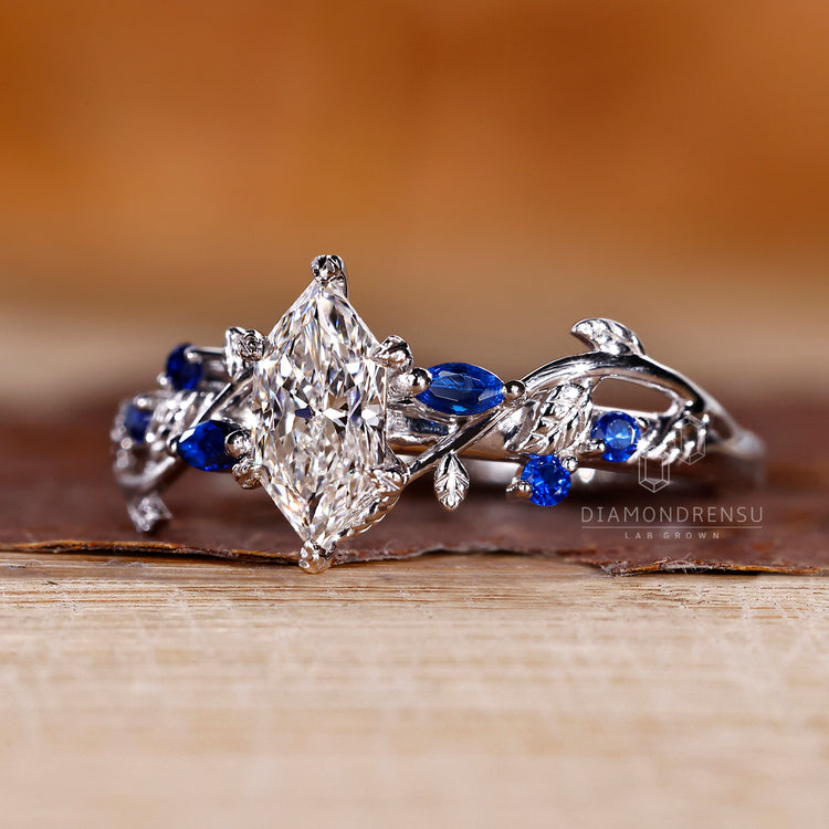 Handmade marquise diamond ring with detailed leaf accents.