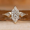 Dutch marquise ring with kite side stone.