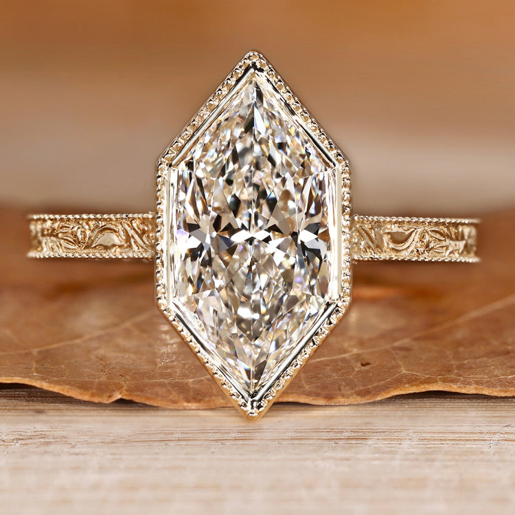 Solitaire diamond ring with Dutch marquise cut diamond.