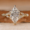 Dutch marquise diamond ring with round side stones.