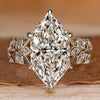 Dutch marquise engagement ring with round side stones.