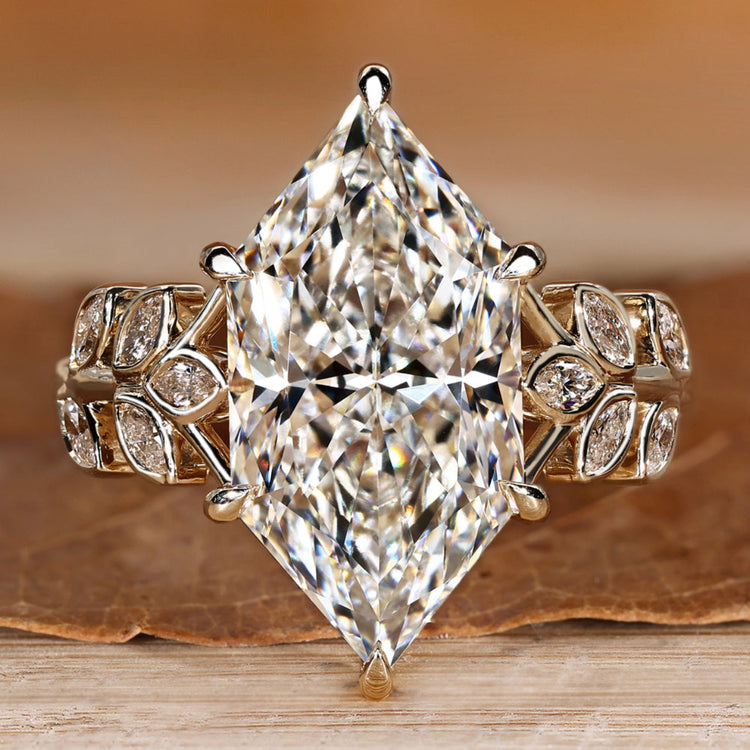 Dutch marquise engagement ring with round side stones.