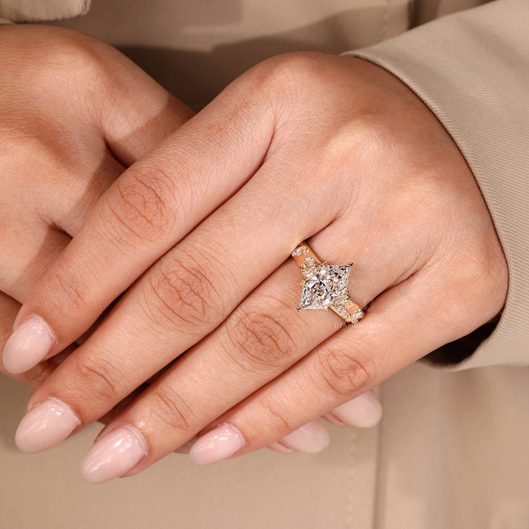 Dutch marquise ring with side stones and cathedral setting.