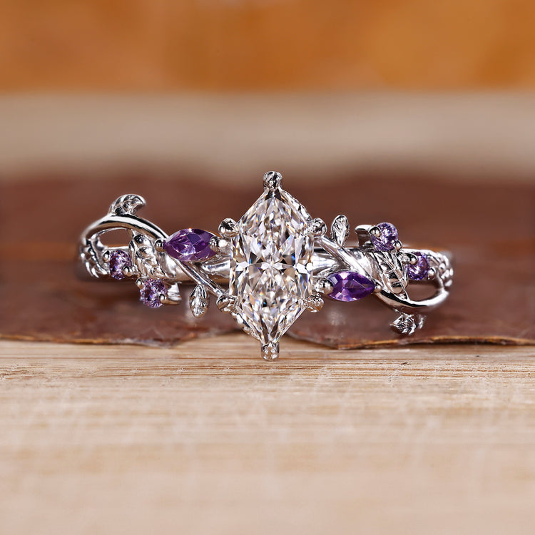 Nature inspired ring with dutch marquise diamond centre.