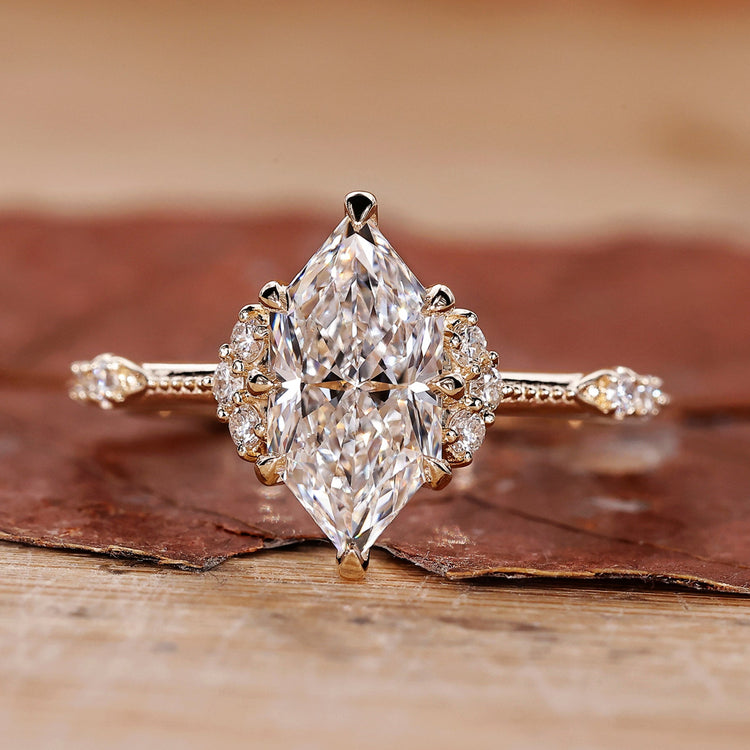 Dutch marquise ring with round side stones vintage style.