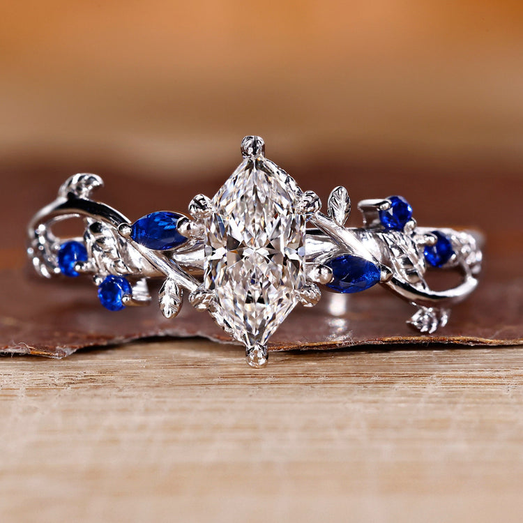 Dutch marquise diamond ring with nature inspired leaf prongs.