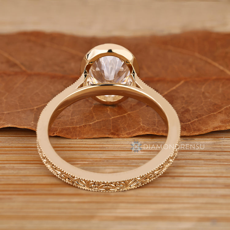 Handmade oval ring with filigree and milgrain details.