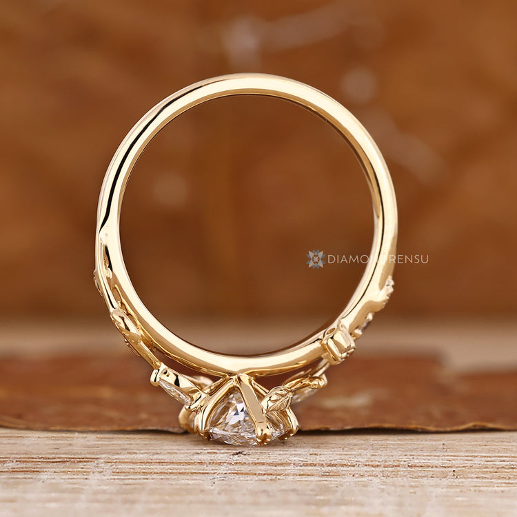 Nature inspired engagement ring with marquise centre diamond.