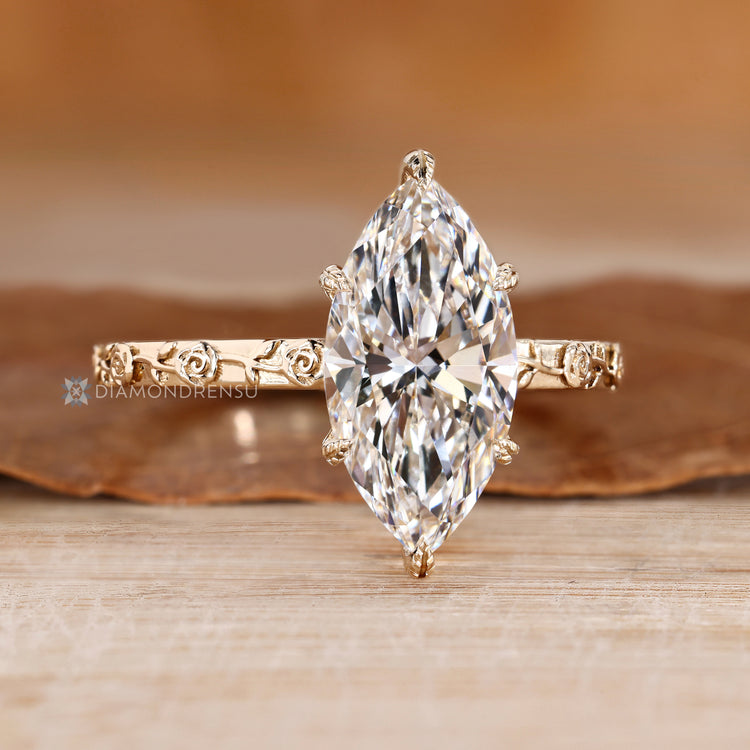 Lab grown diamond ring with six leaf prong setting.