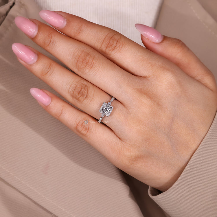 Princess cut ring with four claw prong setting.