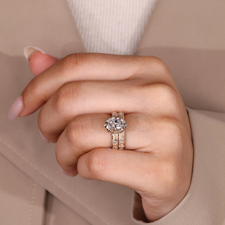 Oval diamond ring with marquise and round side stones.