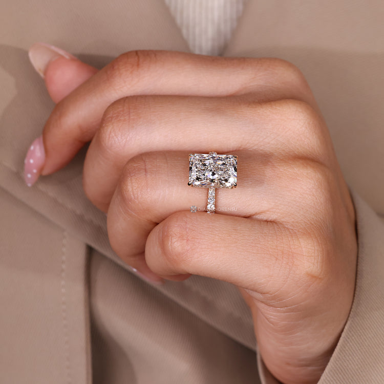IGI certified radiant cut engagement ring with round diamonds.