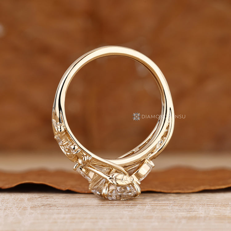 Marquise and round side stones with oval centre diamond.