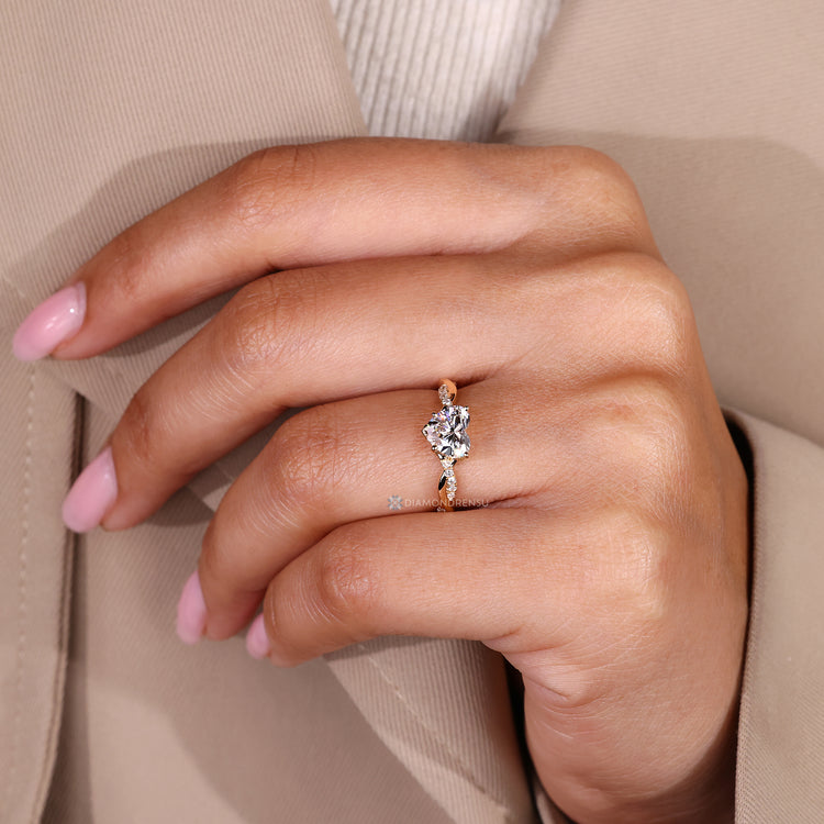 Handmade lab grown diamond ring with round side stones.