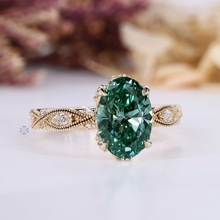 Oval cut ring with hidden halo and round diamonds.