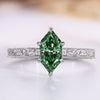 Dutch marquise cut ring with green diamond solitaire style.