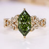 Dutch marquise engagement ring with green centre diamond.