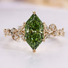 Dutch marquise ring with green centre diamond.