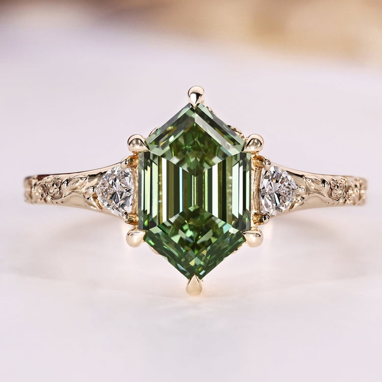 Hexagon cut diamond ring with green centre diamond.