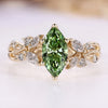 Marquise engagement ring with green centre diamond.