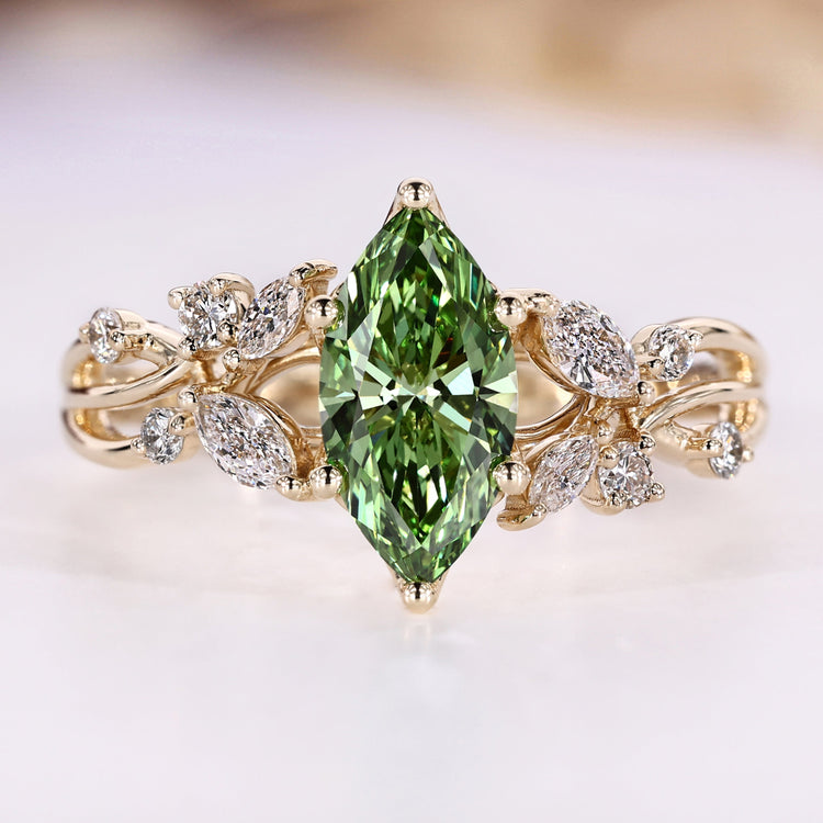 Marquise engagement ring with green centre diamond.