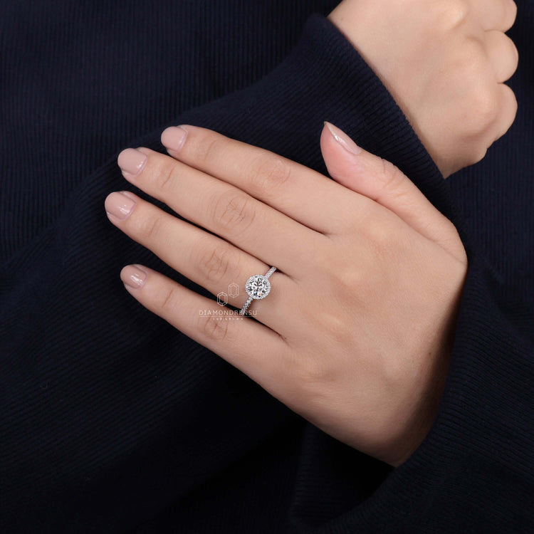 Round diamond ring crafted with pave band detailing for elegance
