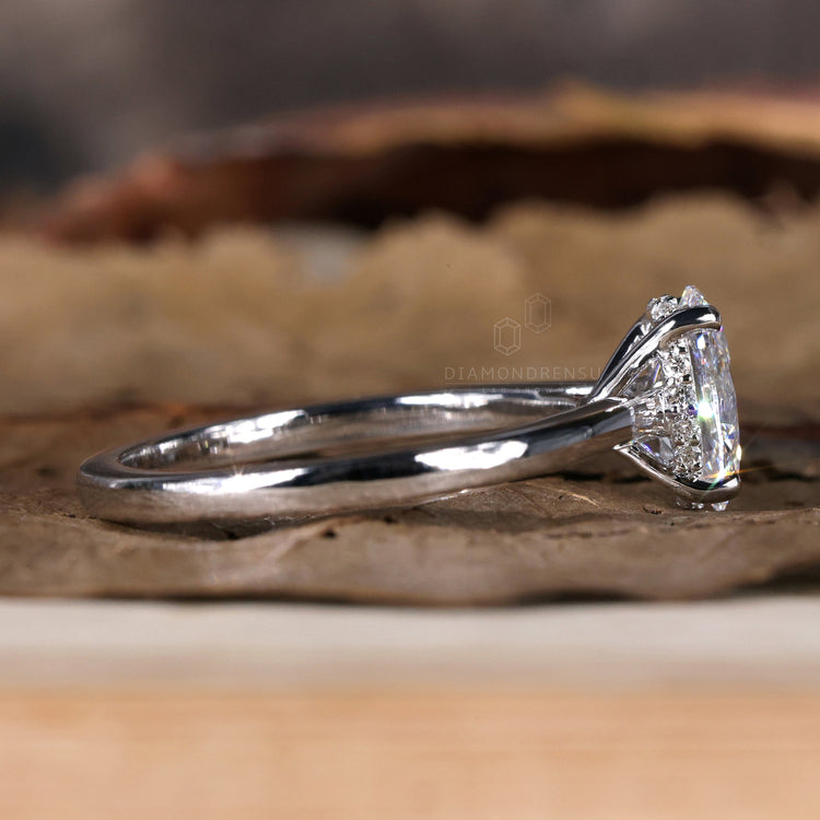 Hidden halo oval engagement ring with lab grown diamond.