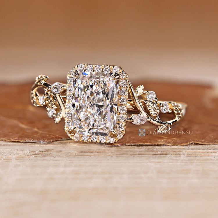 Nature inspired radiant diamond ring with four claw prongs.