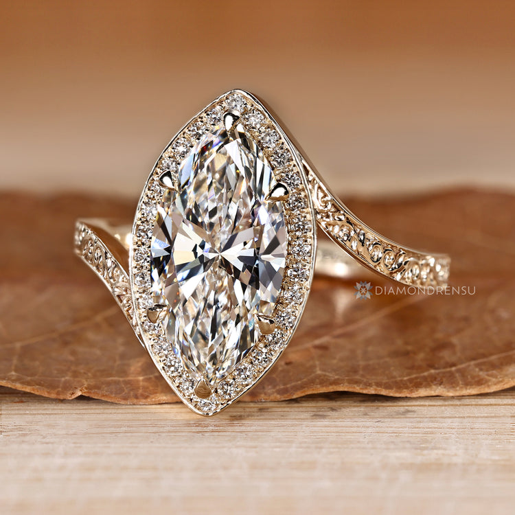 Pavé ring with round diamond halo and side stones.
