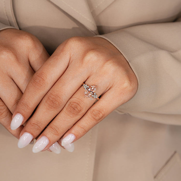 Marquise cut lab grown diamond ring with side stones.