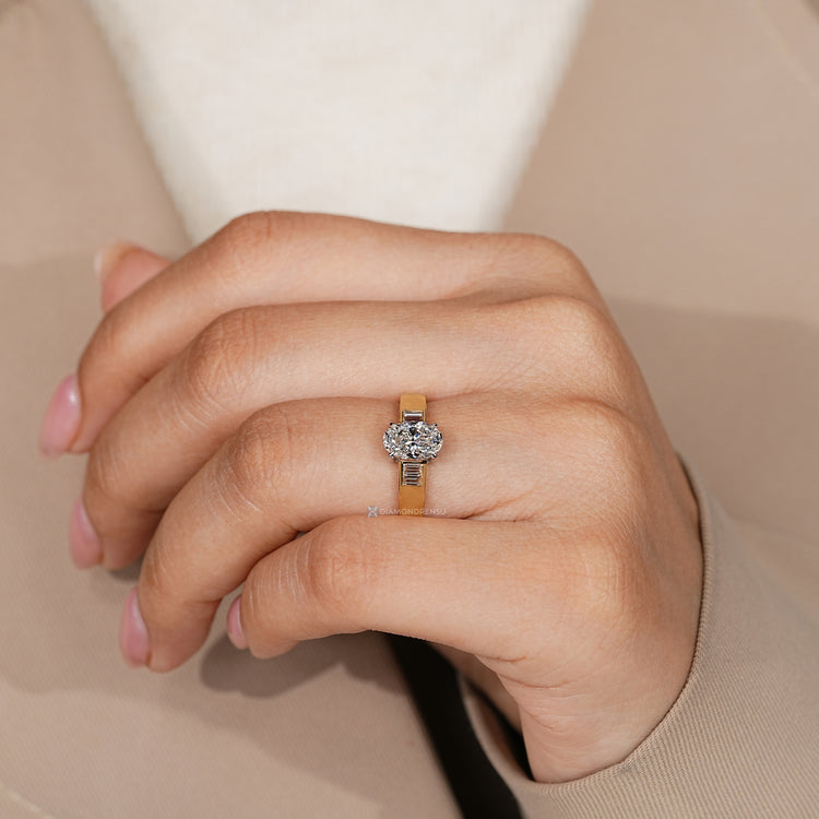 Lab grown oval diamond ring with baguette side stones.