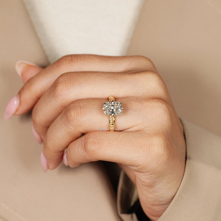 Art deco cushion ring with compass claw prong setting.